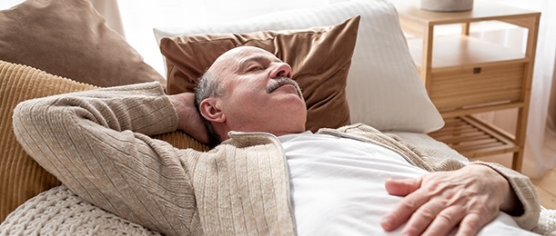 Man resting on a couch