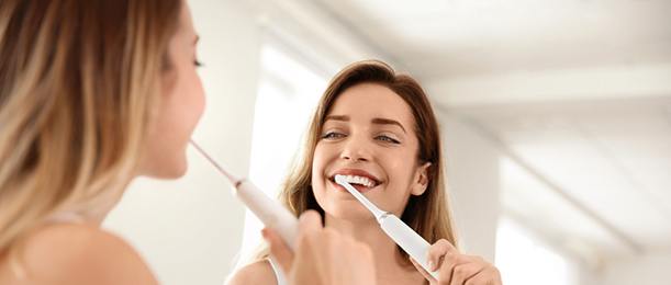 Woman brushing her teeth