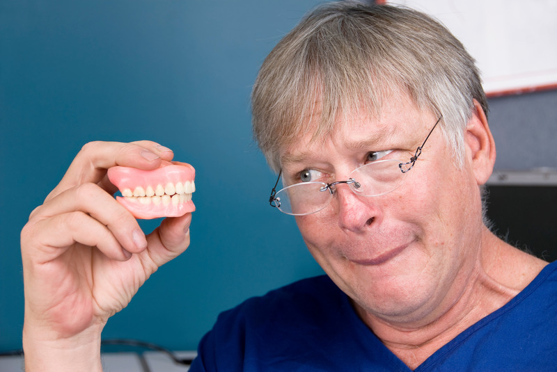 Patient frowning due to lower denture slipping